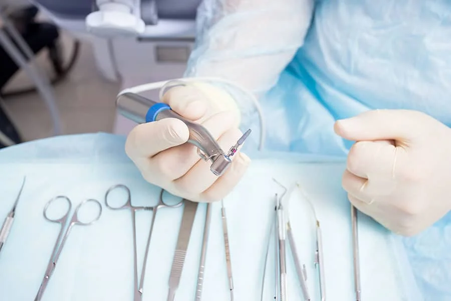 Doctor with dental tools