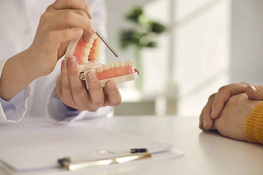 Woman explaining a denture